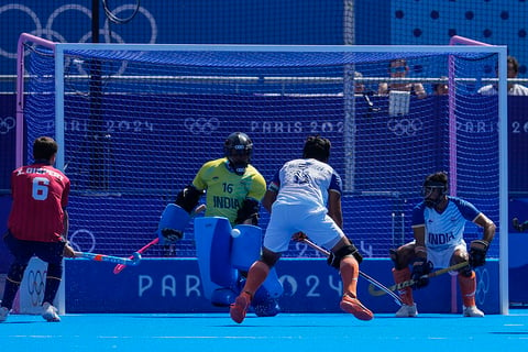 Sreejesh Parattu Reveendran makes save a goal attempt during the men's bronze medal field hockey match against Spain